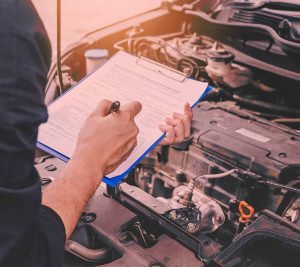 man having car checkups