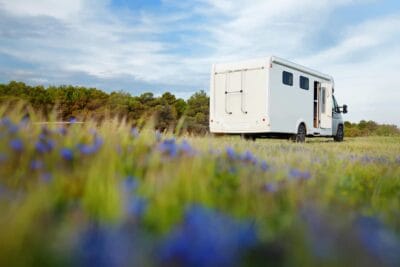 Large motorhome parked for a twelve volt electrical service