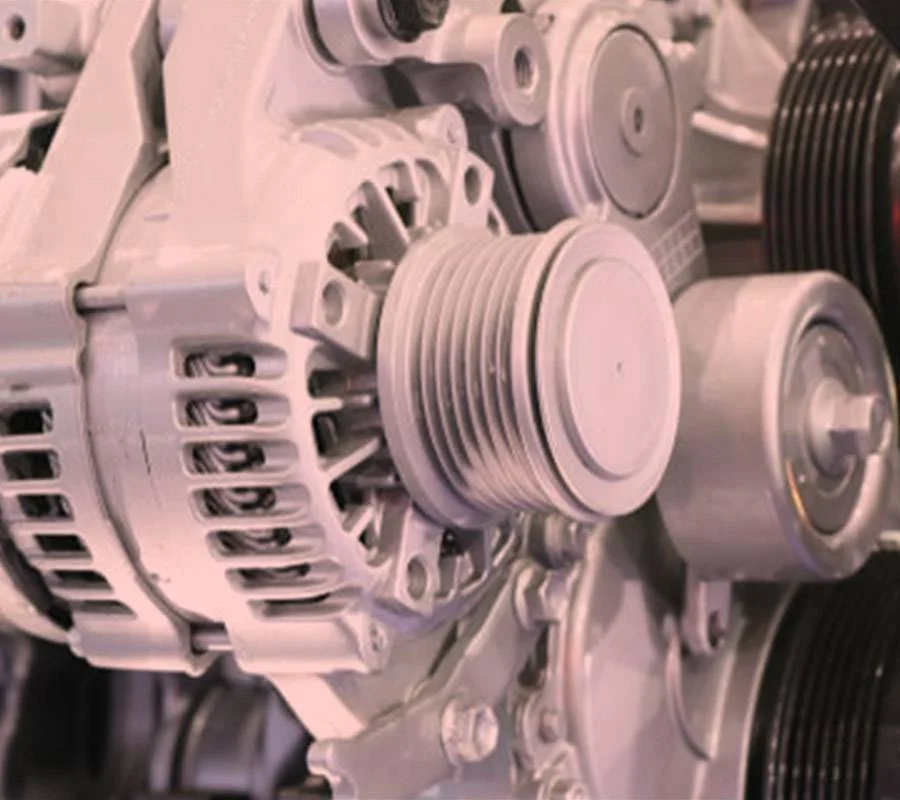 Alternator removed from a car engine for replacement